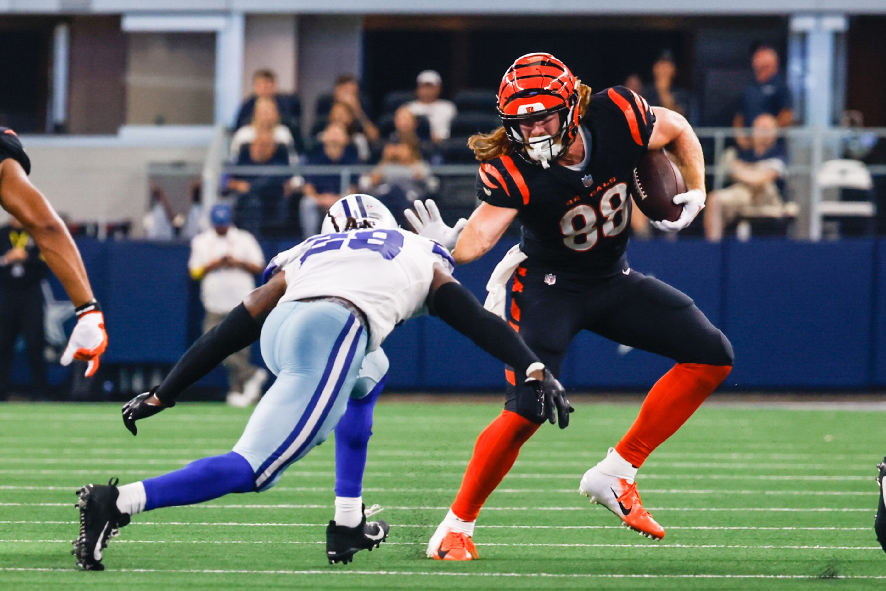 Dallas Cowboys safety Malik Hooker (28) attempts to tackle Cincinnati Bengals tight end...