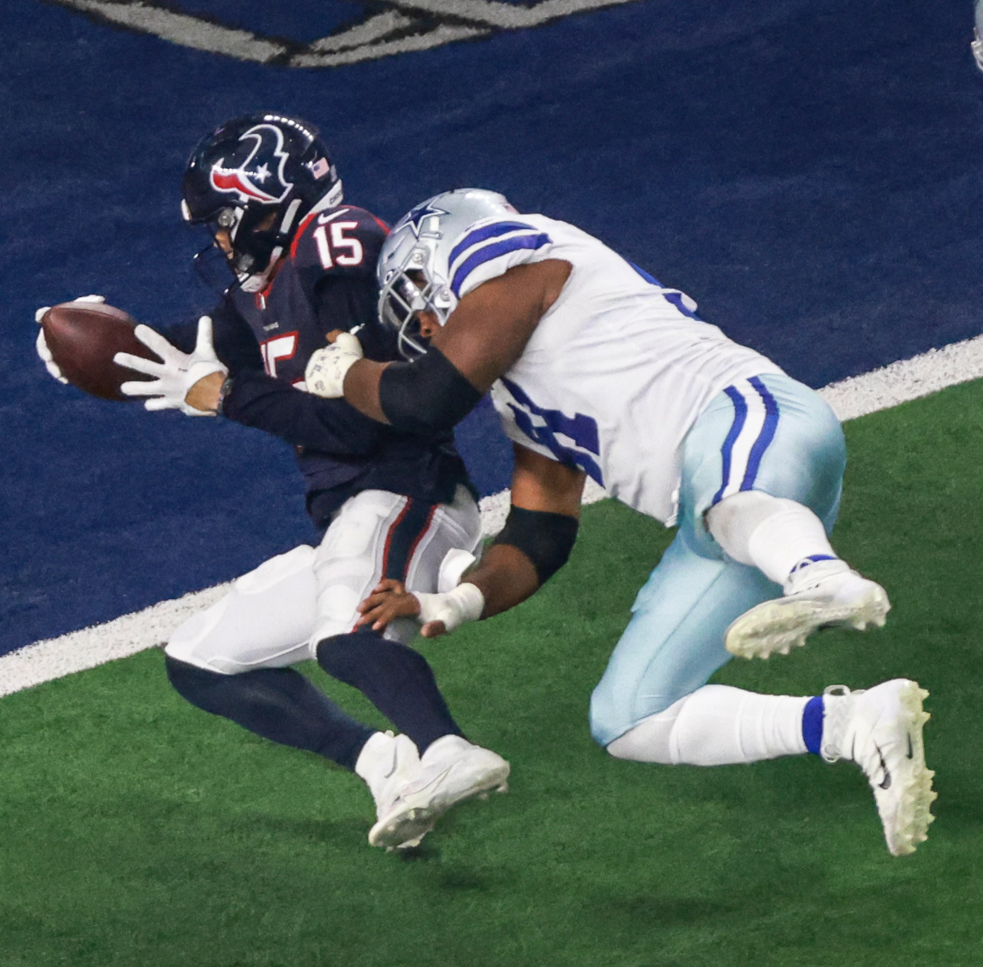 Dallas Cowboys defensive end Carlos Watkins (91) tackles Houston Texans wide receiver Chris...