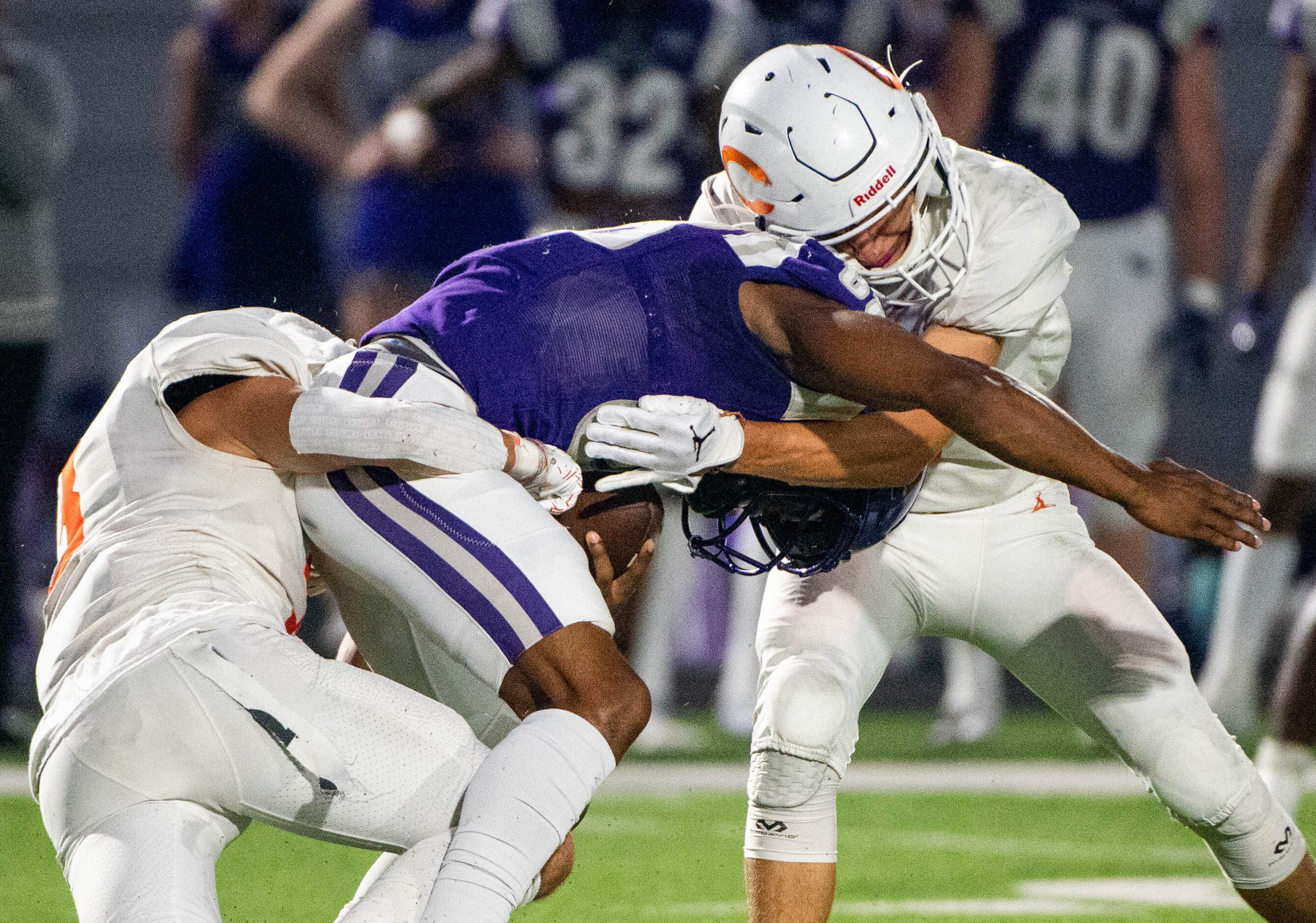 Celina’s Jamisen Driver, left, and Celina Ryan Mikesch, right, tackle Anna wide receiver...