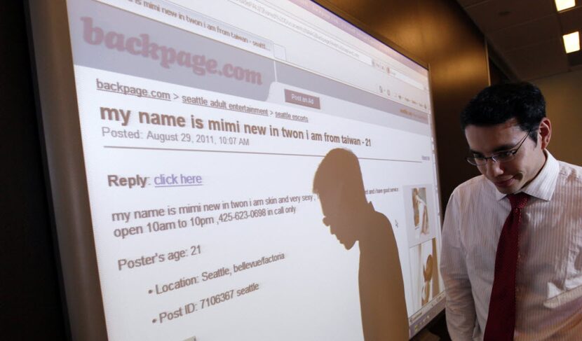 Washington state assistant attorney general Jonathan Mark walks past a display of a...