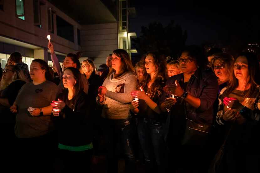 Sunday night's candlelight vigil included prayers and a singing of "Amazing Grace." "Light...