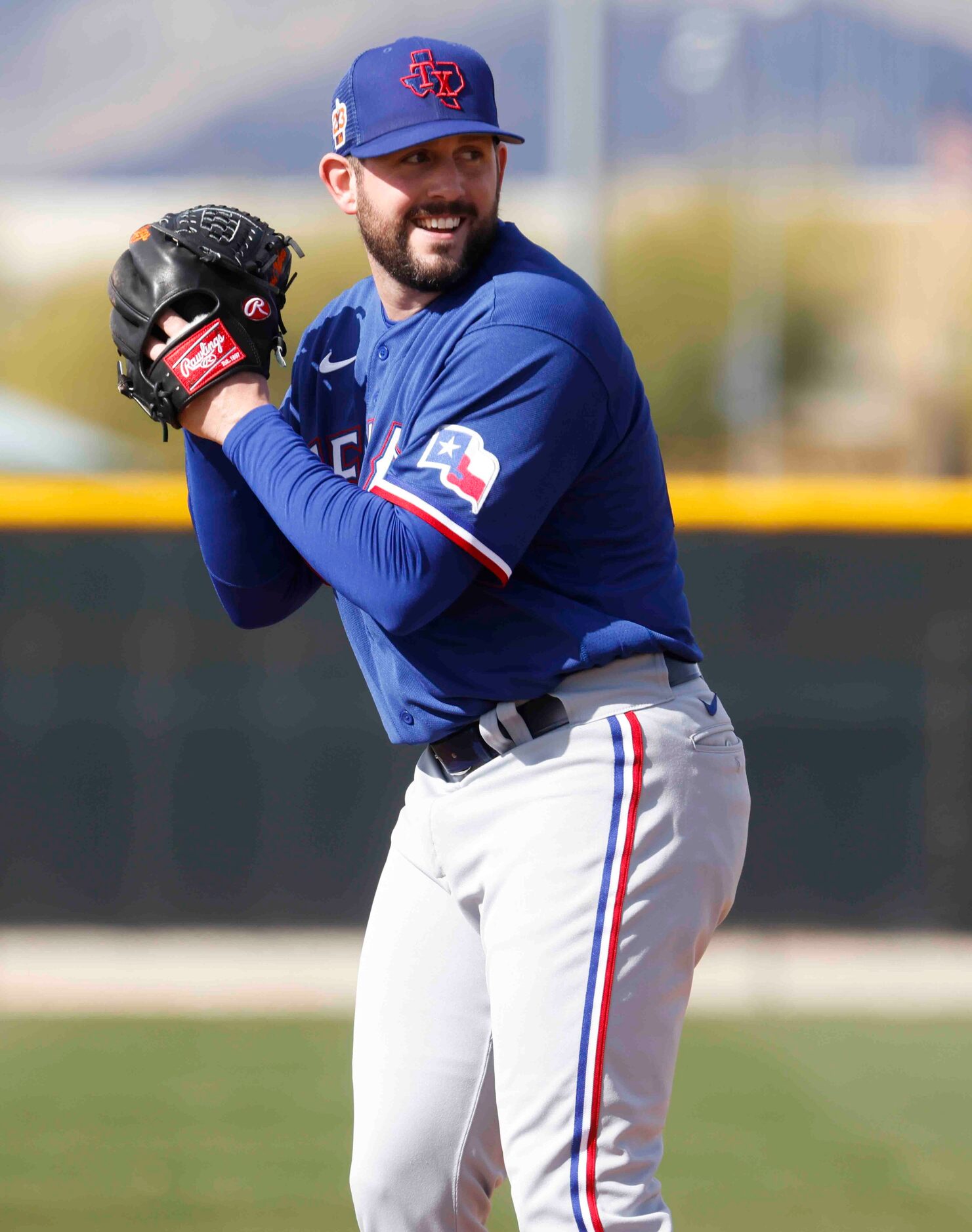 Texas Rangers pitcher Dominic Leone takes part in a practice during a spring training...