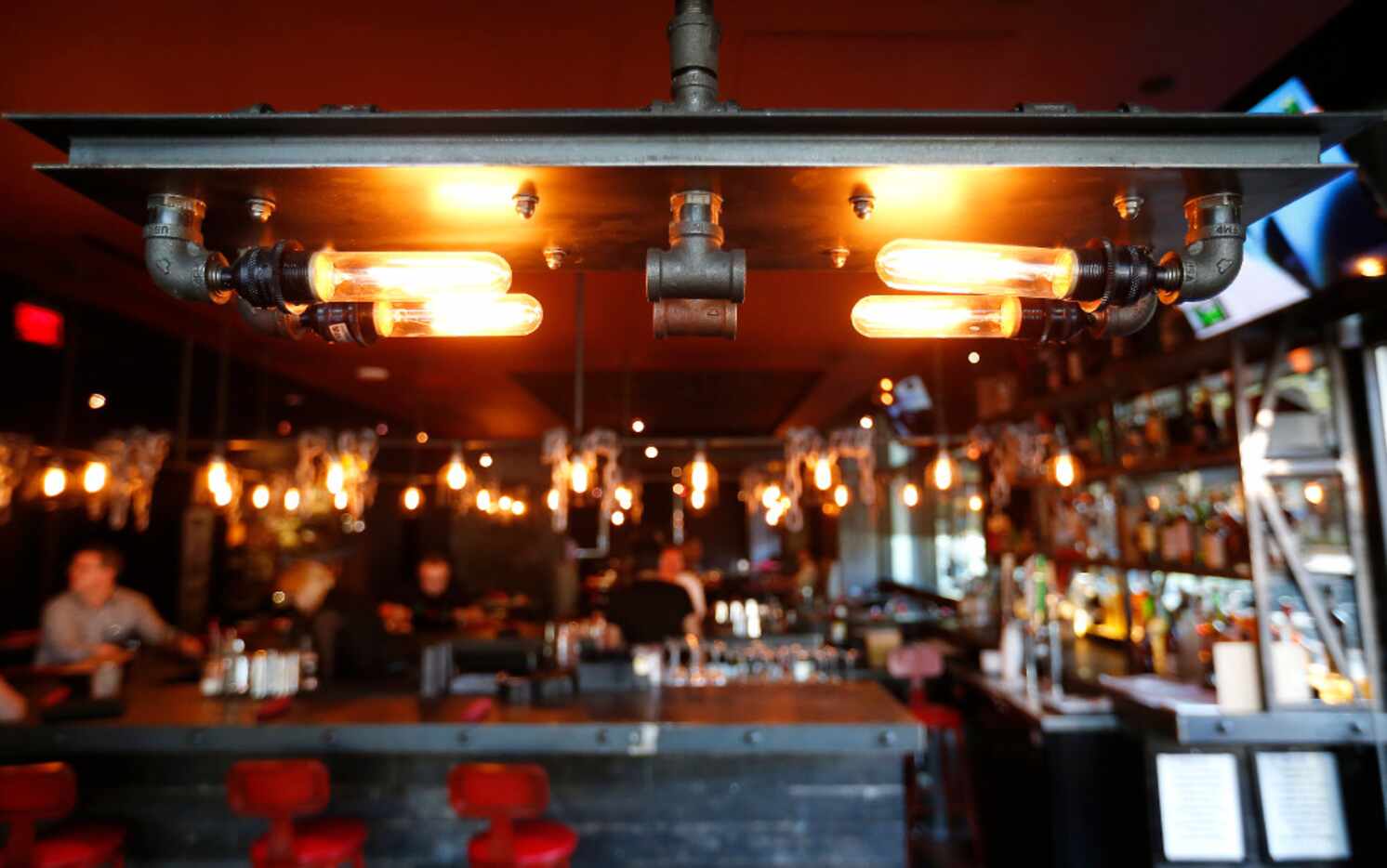 A custom made light fixture is part of an interior at Tortaco in Dallas, Thursday, Nov. 17,...