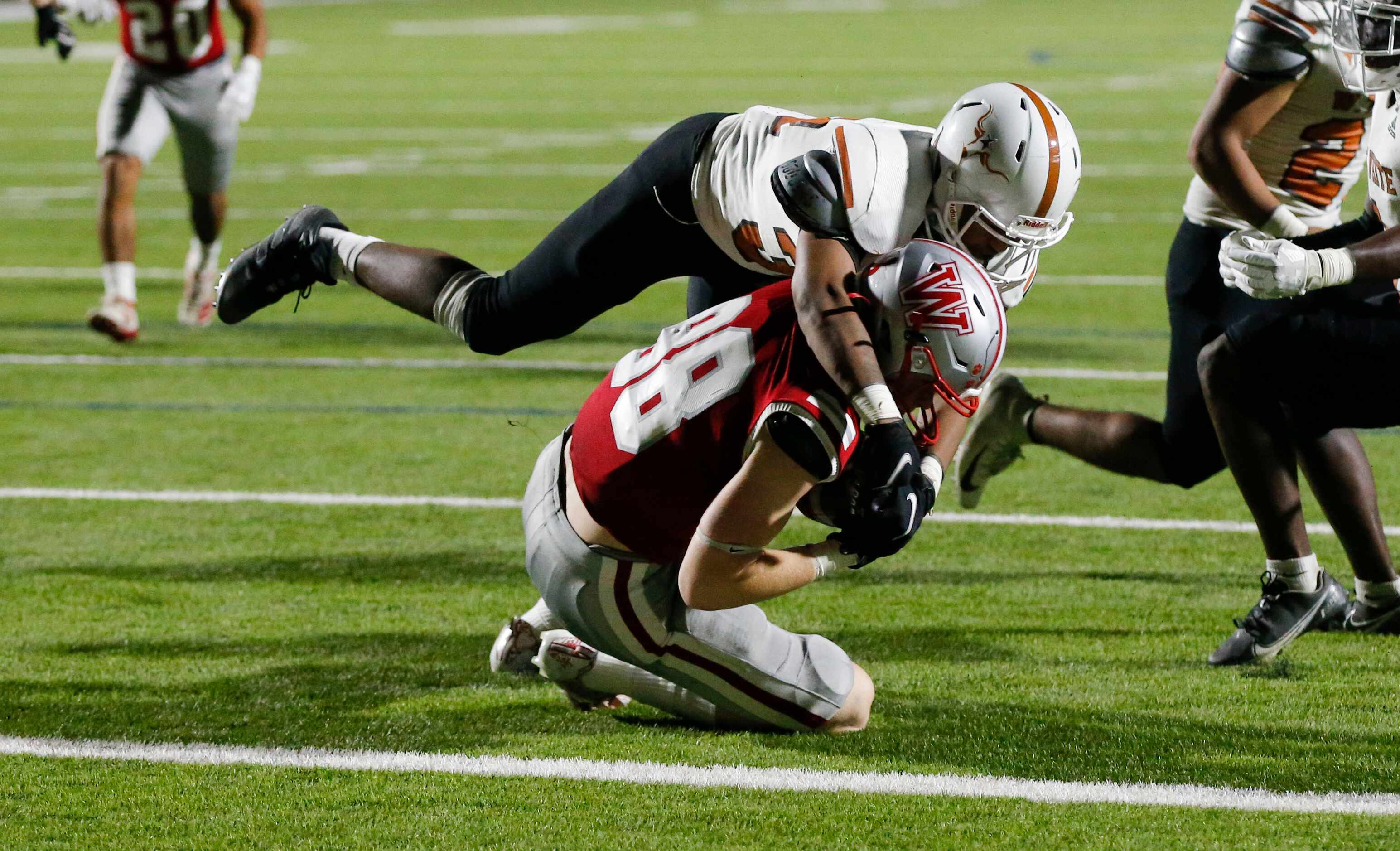 Woodrow Wilson senior wide receiver Noah Calhoun (88) scores a touchdown as W. T. White...