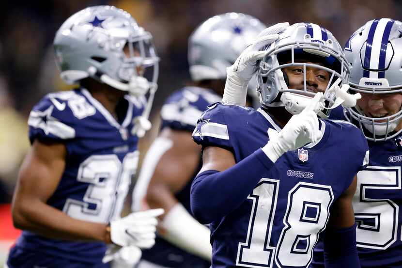 Dallas Cowboys free safety Damontae Kazee (18) silences the New Orleans Saints crowd as he...