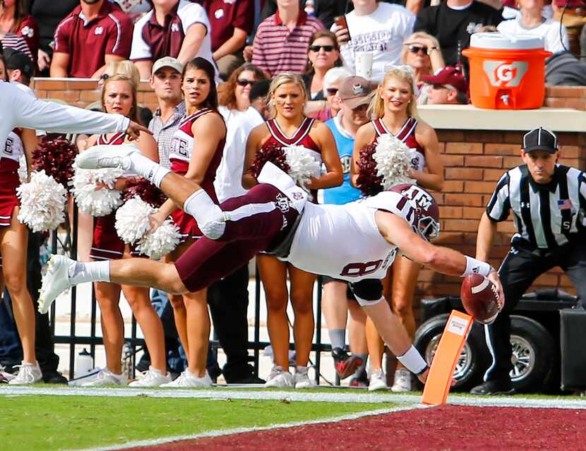 Quarterback Trevor Knight #8 of the Texas A&M Aggies dives in for a touchdown during the...
