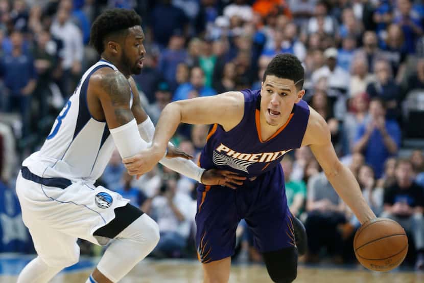 Wesley Matthews tried to guard Phoenix's Devin Booker, but even his best efforts couldn't...