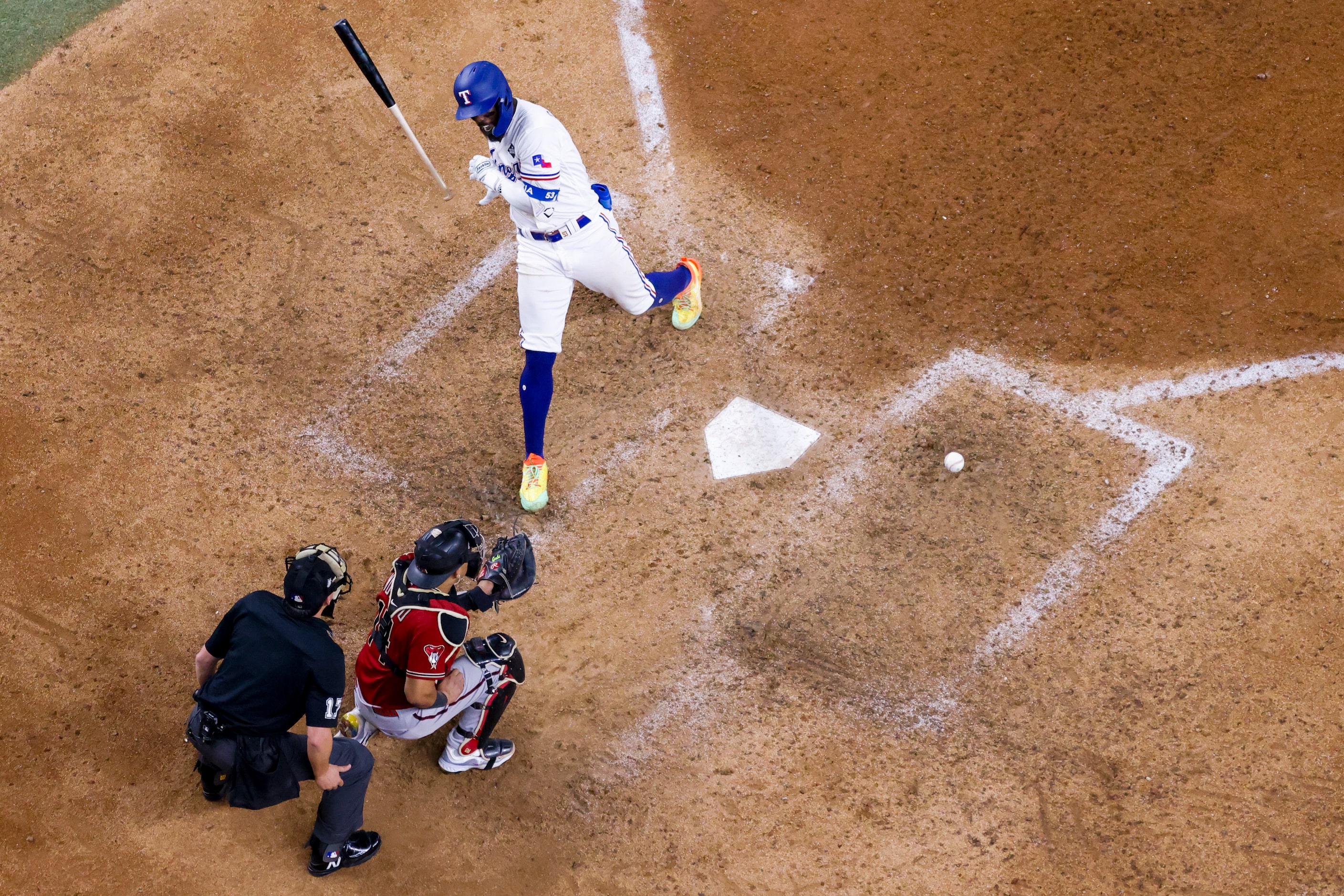 Texas Rangers' Adolis Garcia is hit by a pitch from Arizona Diamondbacks relief pitcher Paul...