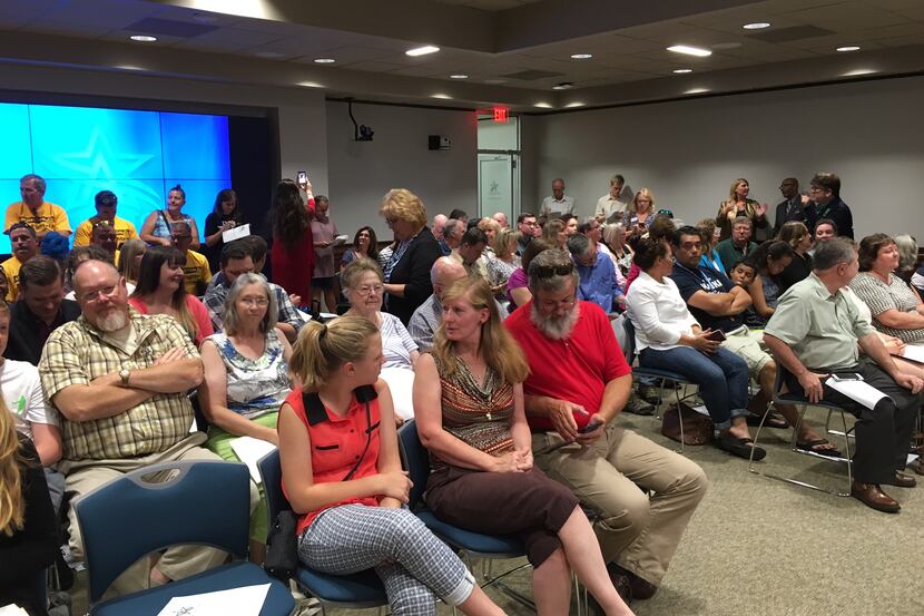 Residents packed the third-floor board room during the Arlington City Council meeting...