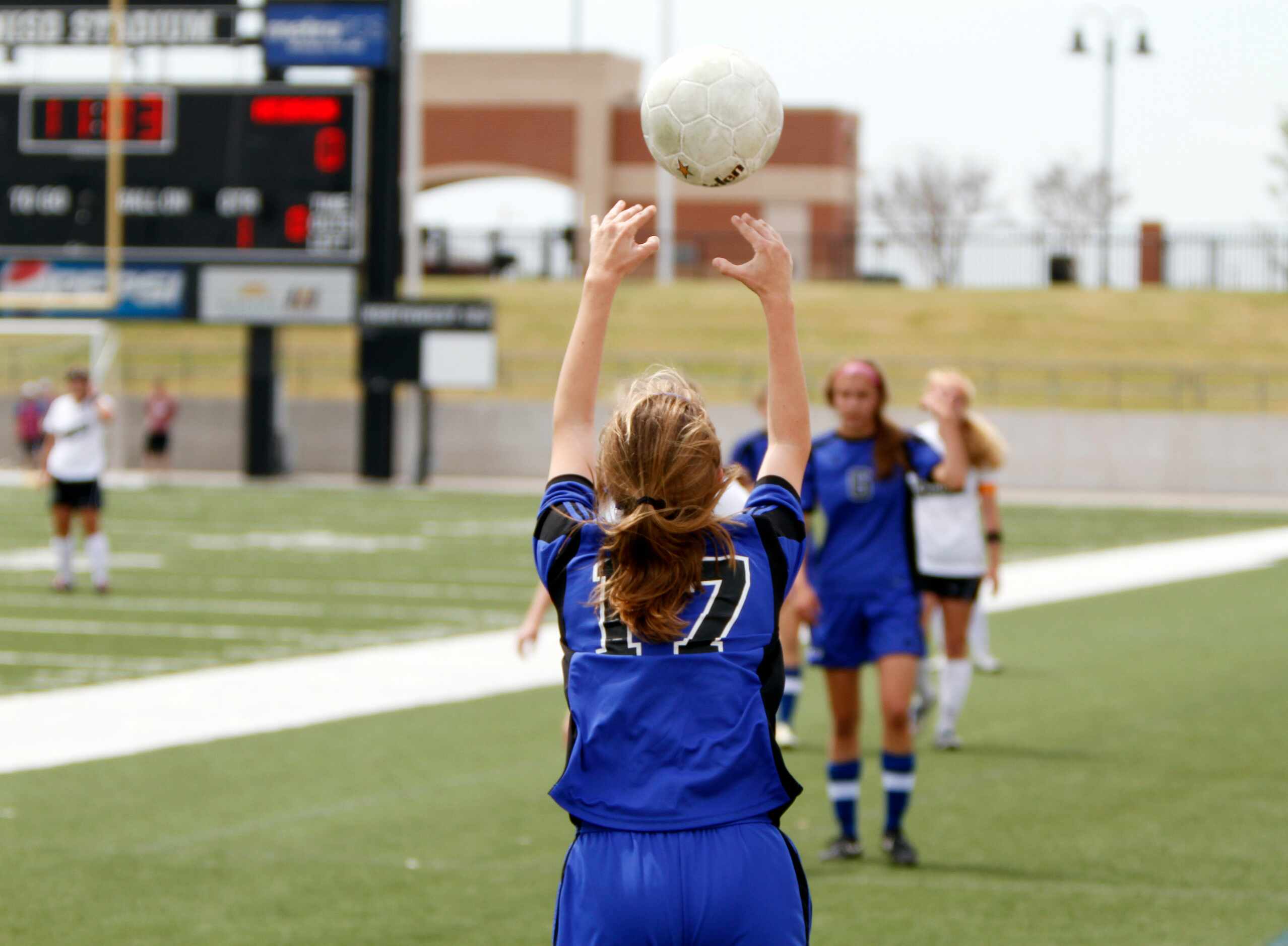 Hebron junior defender Kristin Carroll (17) prepares to toss the ball into play against...
