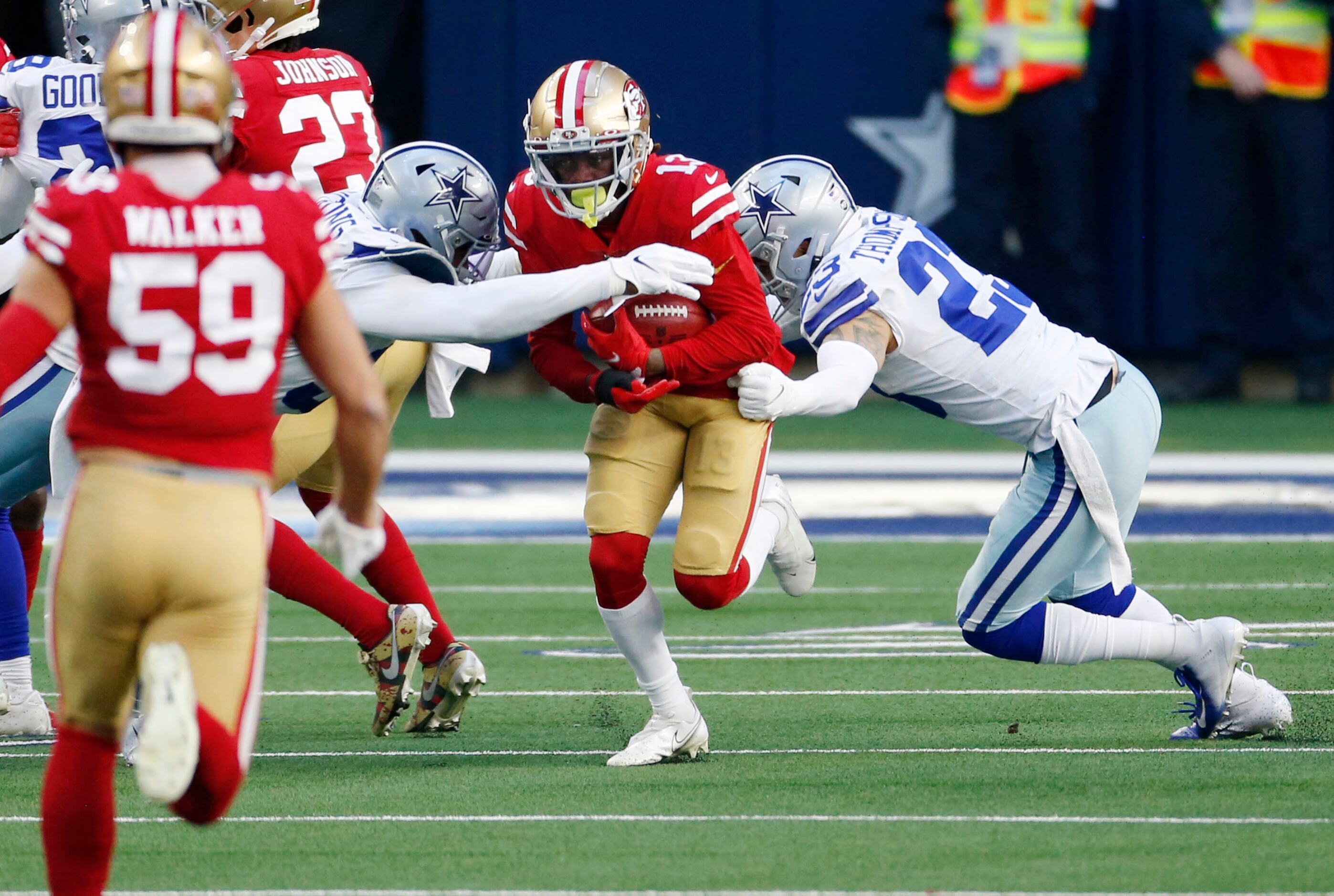 Cowboys keep postseason hopes alive with 41-33 win against 49ers