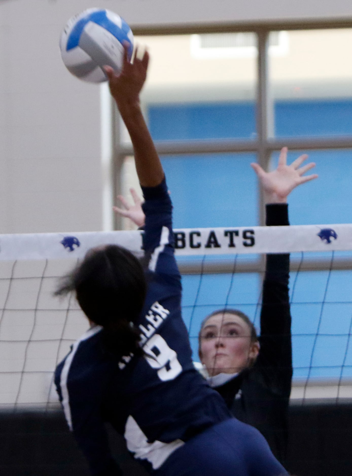 Keller's Leah Ford (9) skies to deliver a shot over the defense of Trophy Club Byron...