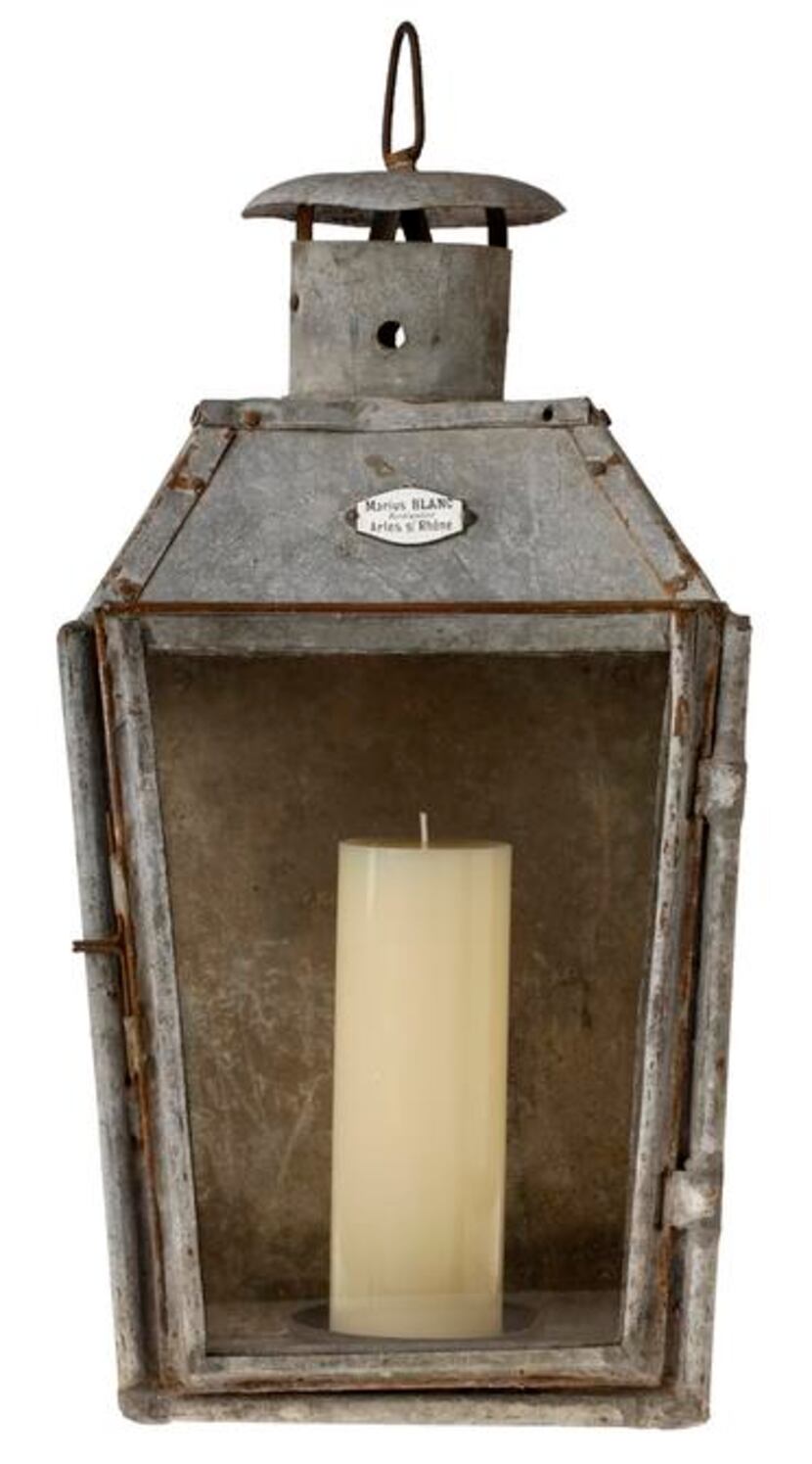 
Heirloom. This real-deal, circa-1900s metal lantern still boasts “Marius Blanc,” the...