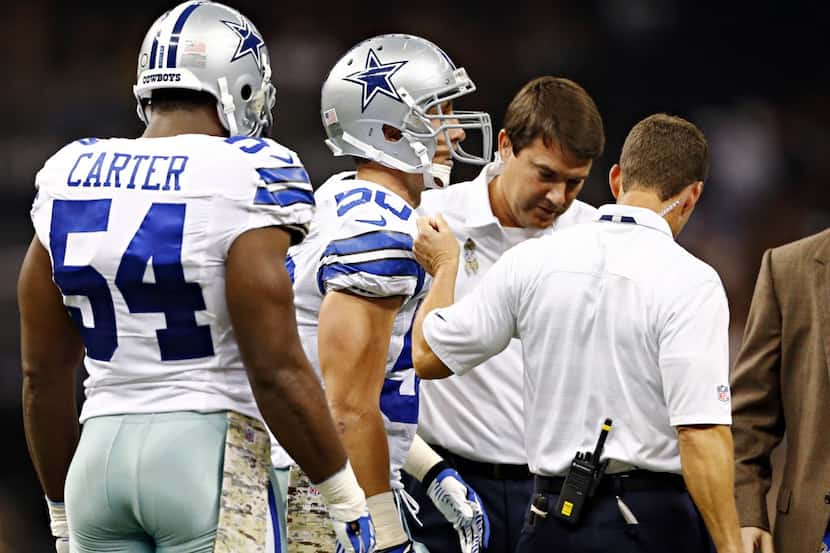 Dallas Cowboys middle linebacker Sean Lee (50) is led off the field after an injury during...