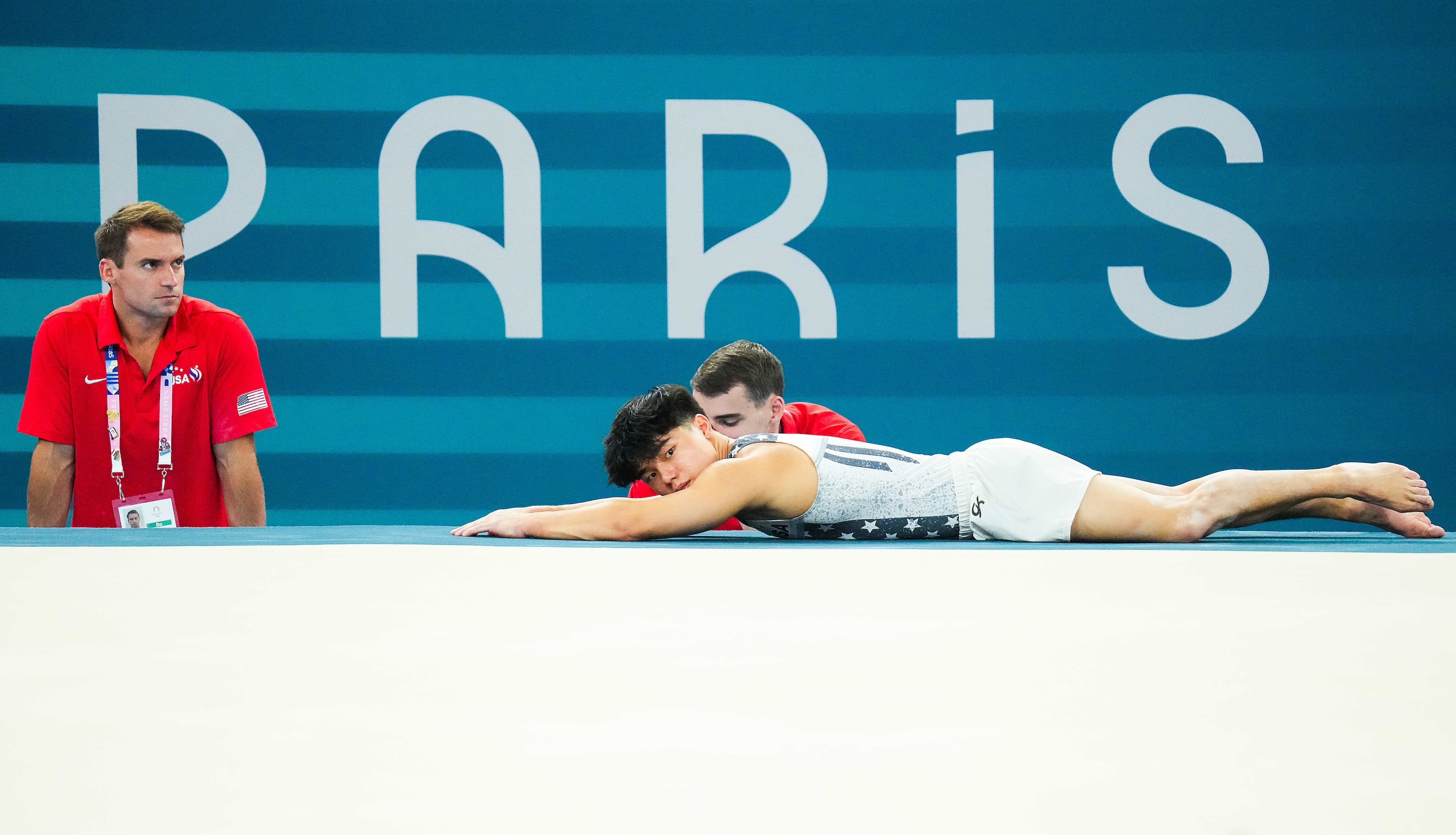 Asher Hong of the United States stretches during gymnastics podium training ahead of the...