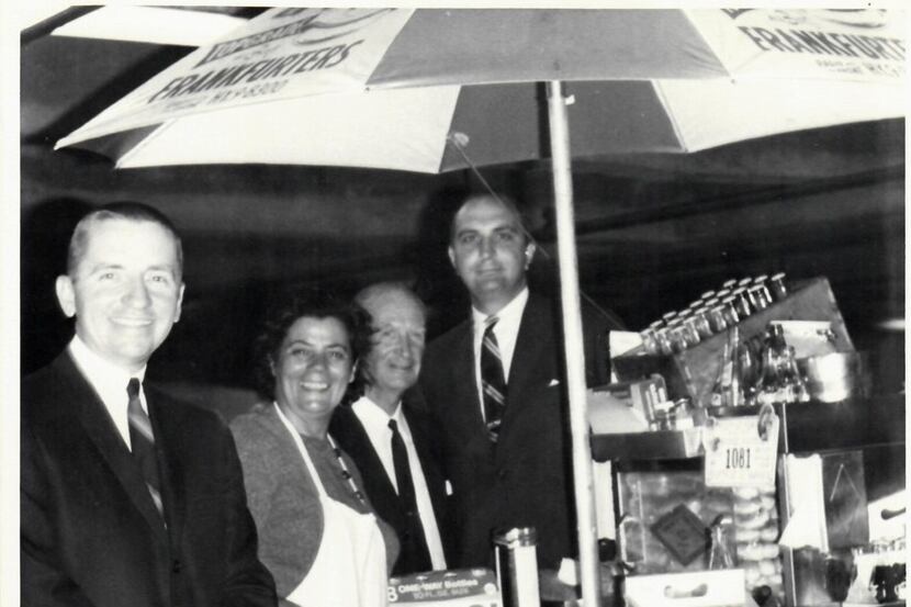 Ross Perot, left, with New York City hot dog vendor Rudy Smutny and Ken Langone, who was...