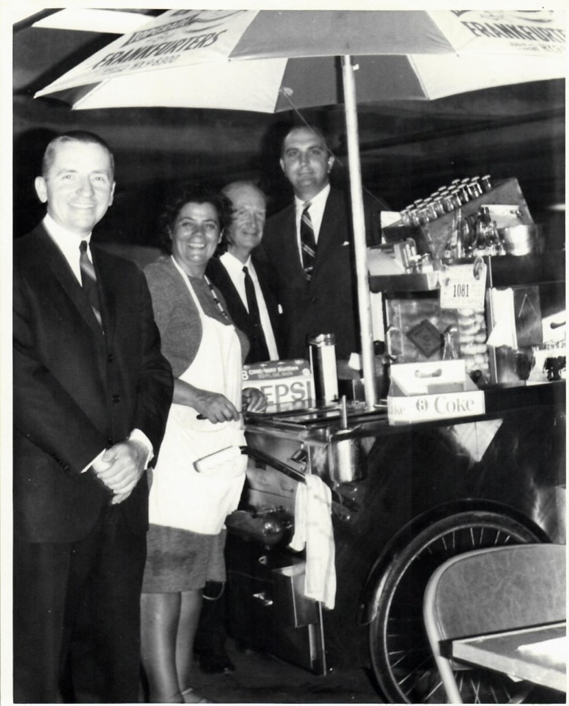 Ross Perot, left, with New York City hot dog vendor Rudy Smutny and Ken Langone, who was...