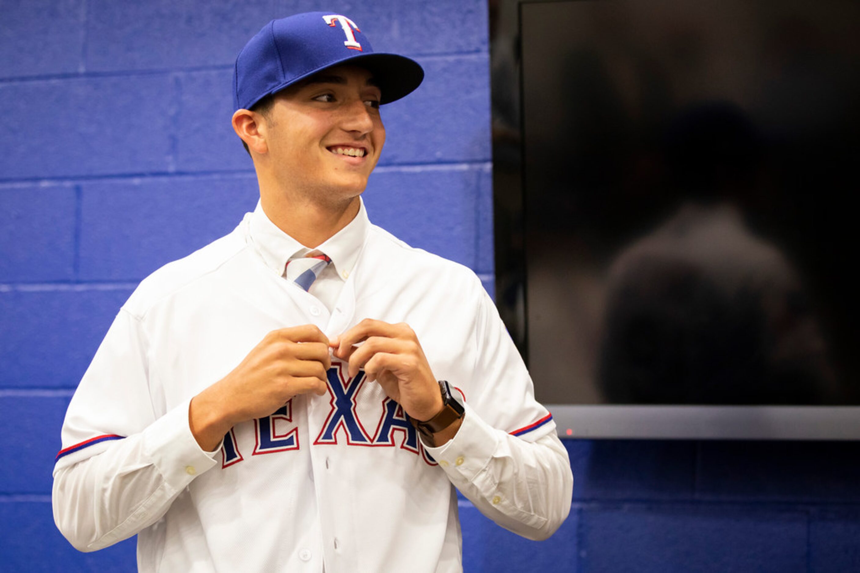 Texas Rangers 2nd round pick, pitcher Owen White of Jesse Carson (NC) High School, dons a...