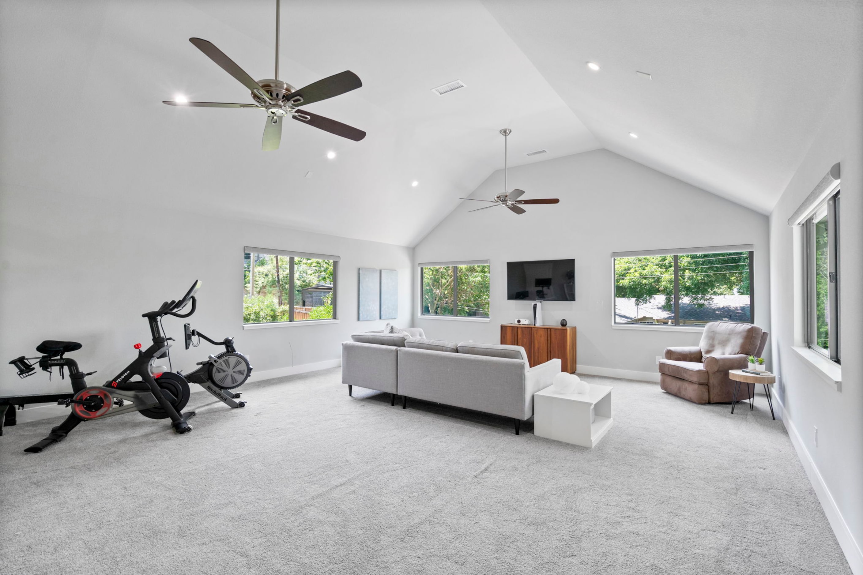 Upstairs, the home has both a game room and a media room.