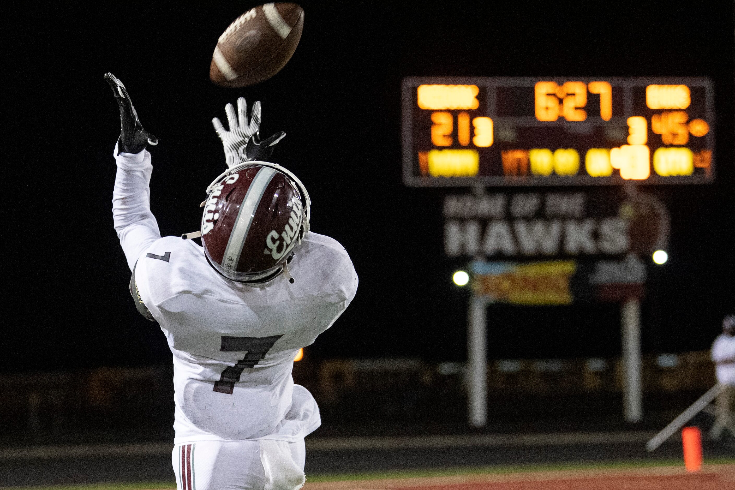 Ennis senior wide receiver Laylon Spencer (7) hauls in a pass from quarterback Collin Drake...