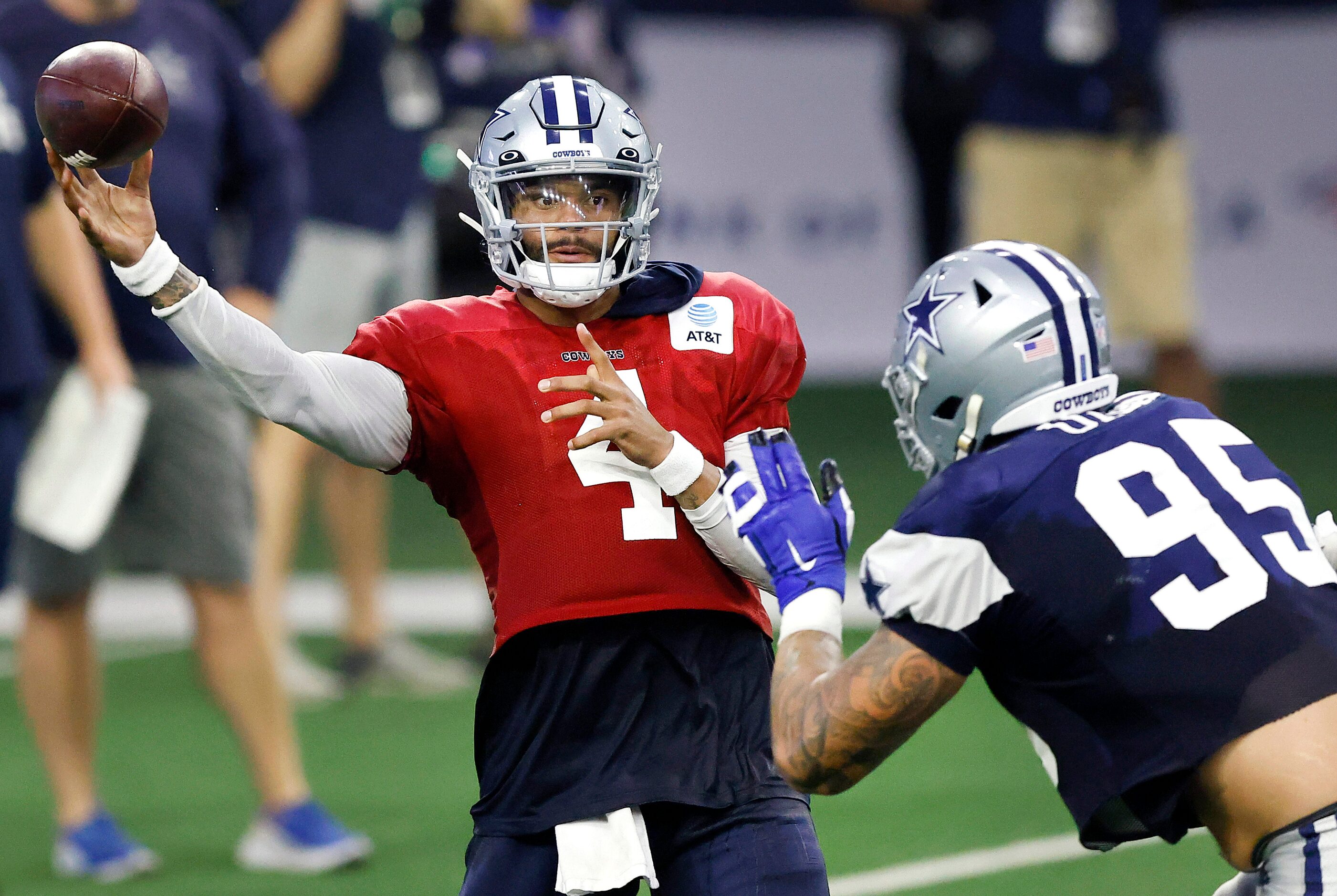 Dallas Cowboys quarterback Dak Prescott (4) whips a pass towards the sideline as he's...