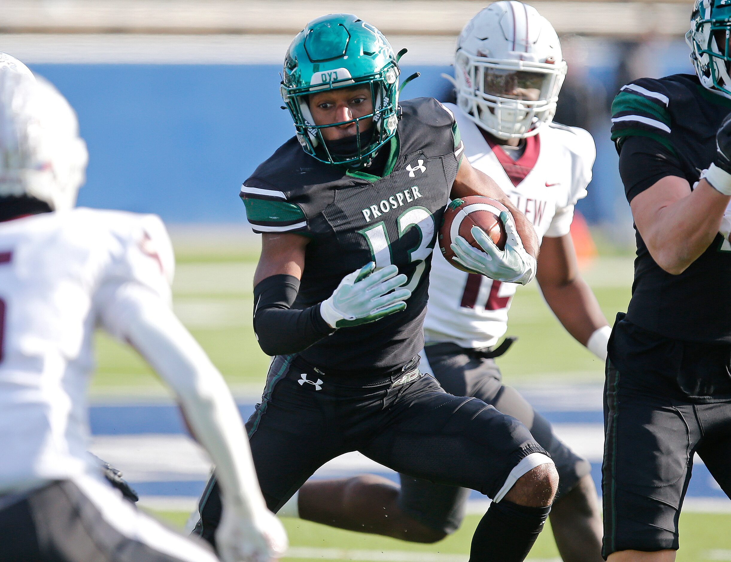 Prosper High School wide receiver Prentice Sanders (13) looks for room to run during the...