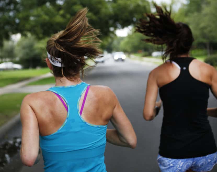 Marla Sewall goes on a run with her exercise partner Kristin Emerson (right) around their...