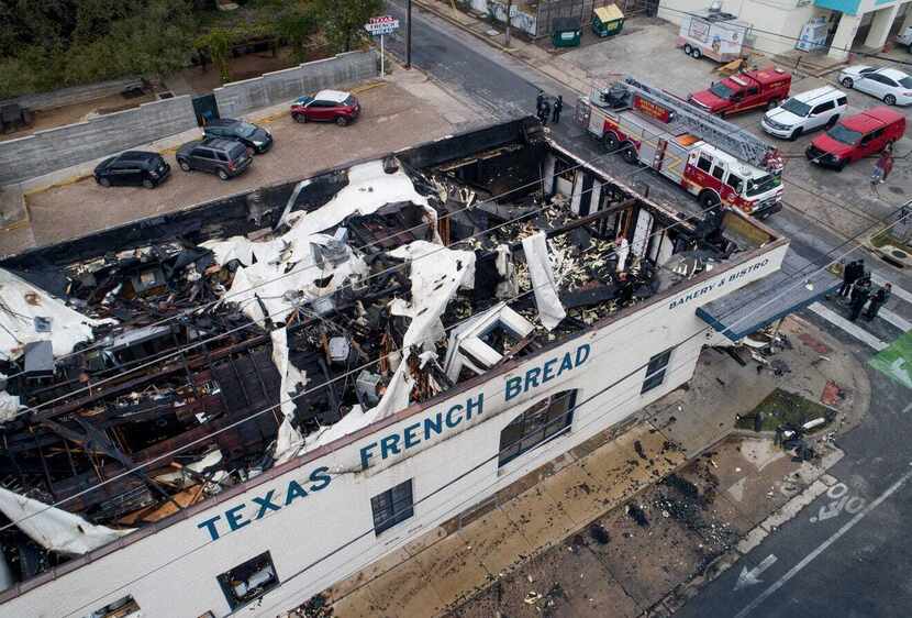 A look at Texas French Bread in Austin from above shows major damage to the roof after a...