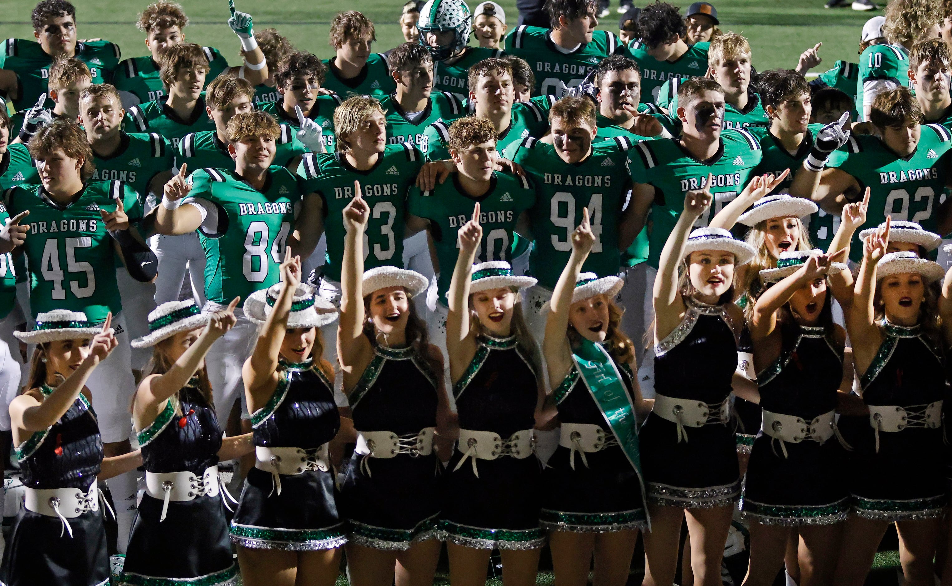The Southlake Carroll football and drill team sing the school song following their 38-35 win...
