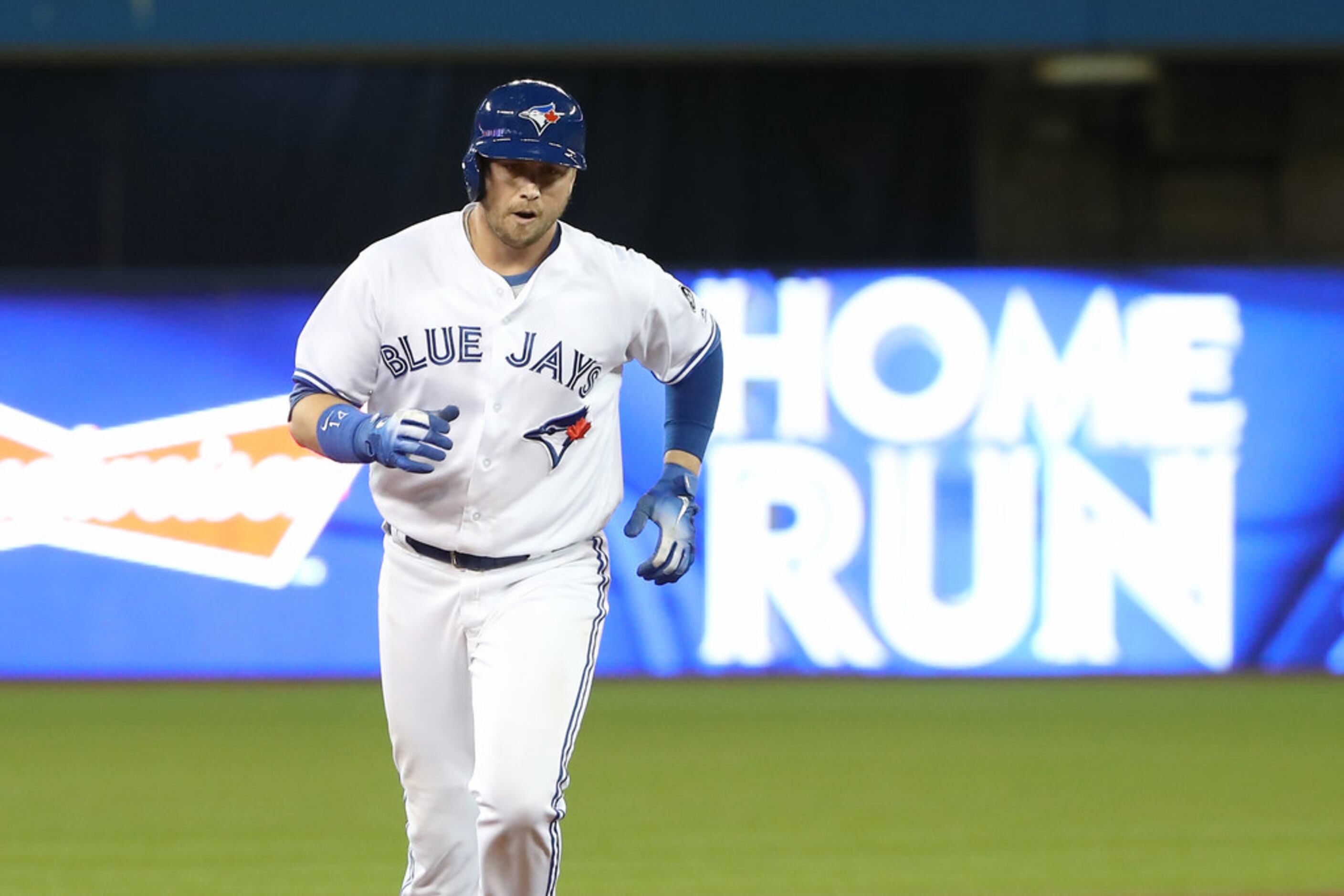 Toronto Blue Jays first baseman Justin Smoak (14) and Toronto Blue