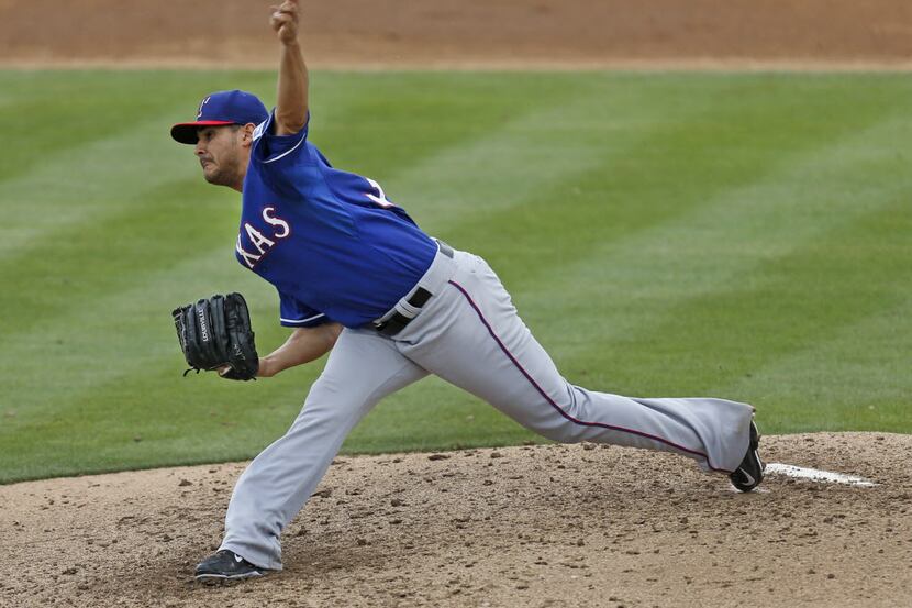 Texas starting pitcher Martin Perez throws a second-inning pitch during the Texas Rangers...