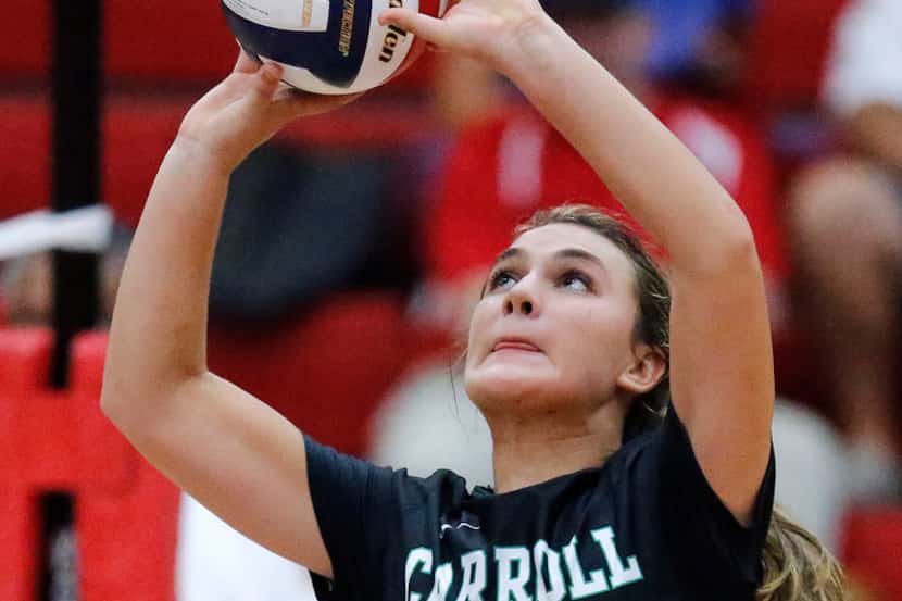 Southlake Carroll setter McKenzie Nichols (4) makes one of her 45 assists Tuesday's 3-1 road...
