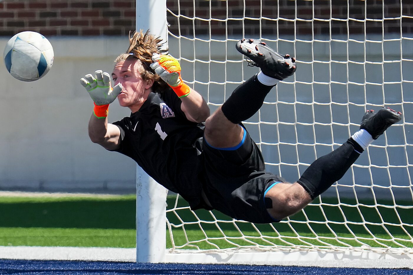 Allen goalkeeper Alec Setterberg (1) makes a save on the final shot against Lake Highlands...