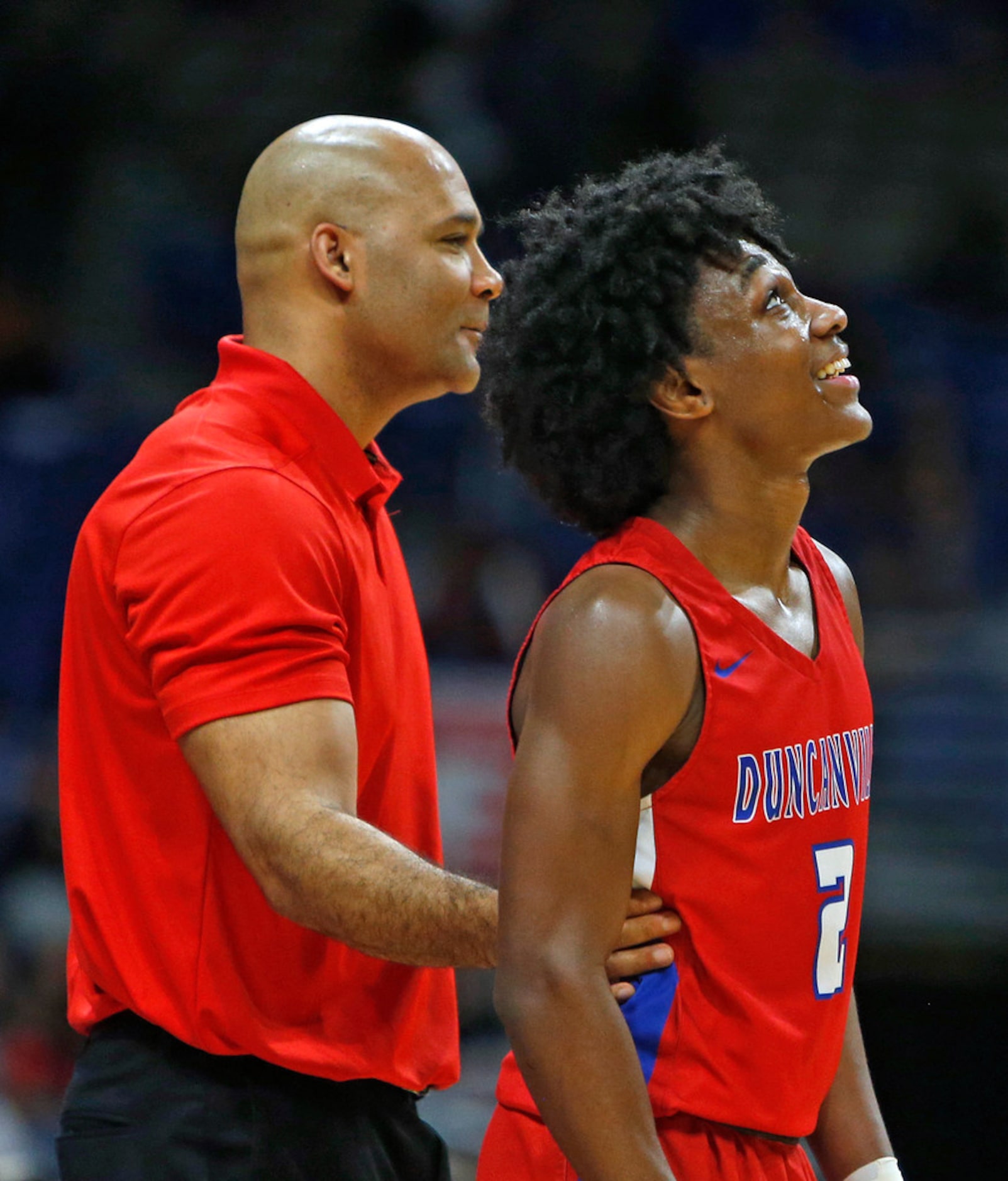 Duncanville head coach David Peavy look on with Duncanville's Ja'Bryant Hill #2 in closing...