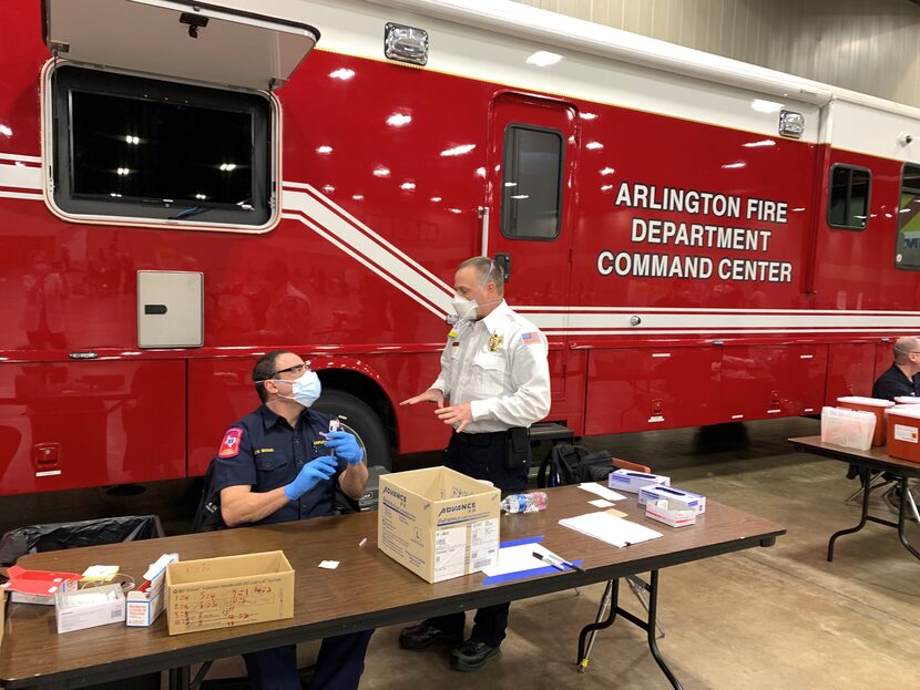 Michael Marsh, operations manger at American Medical Response Arlington, and James Boque,...