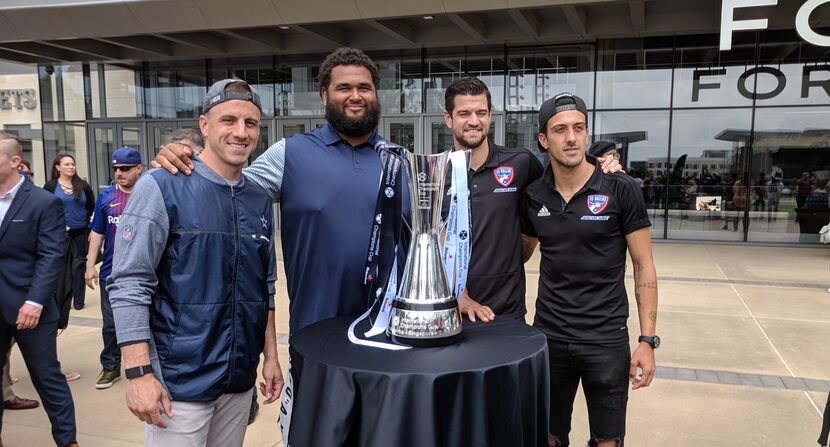 Dan Bailey, Joe Looney, Jimmy Maurer, and Maxi Urruti pose with the ICC trophy.  (5-1-18)