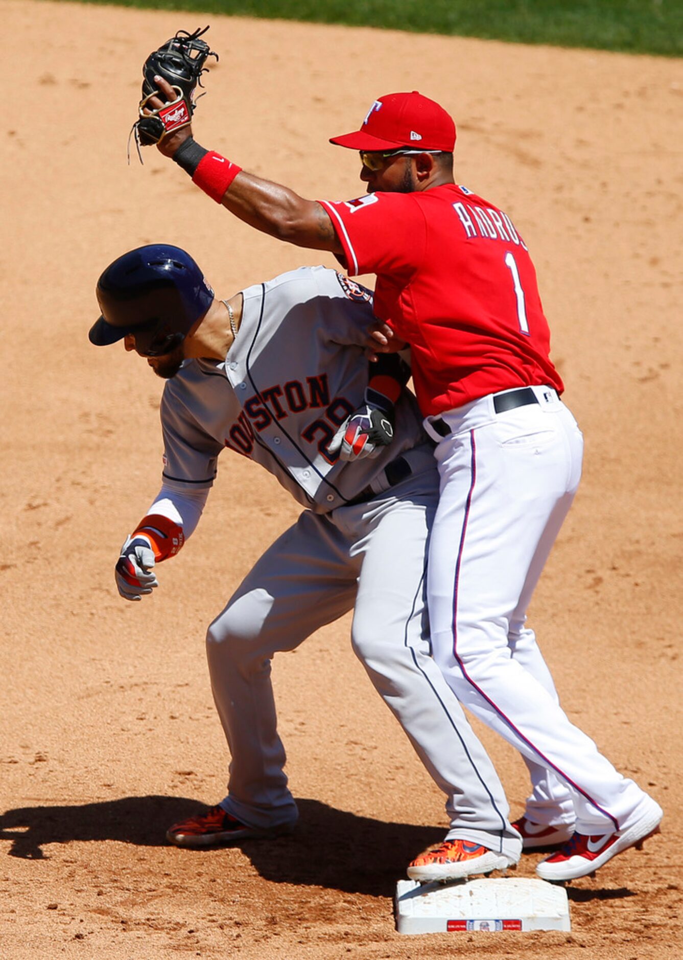 Texas Rangers shortstop Elvis Andrus (1) bumps Houston Astros batter and former teammate...