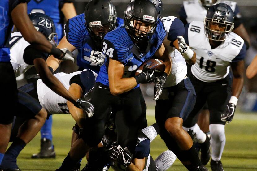 North Forney running back Calbin Ribera (34) moves the ball against Wylie East in the first...