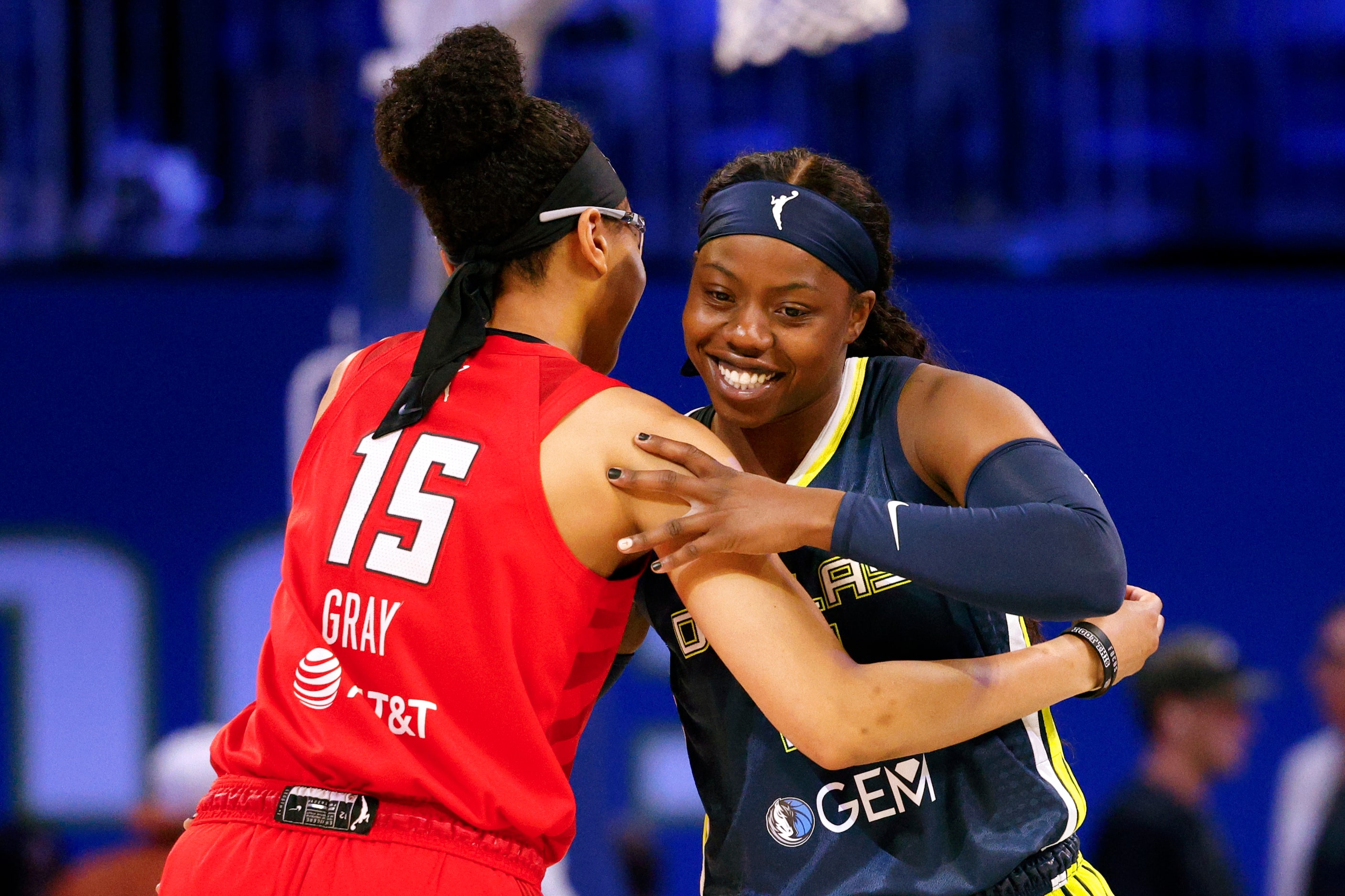 Dallas Wings guard Arike Ogunbowale (24) greets Atlanta Dream guard Allisha Gray (15) before...