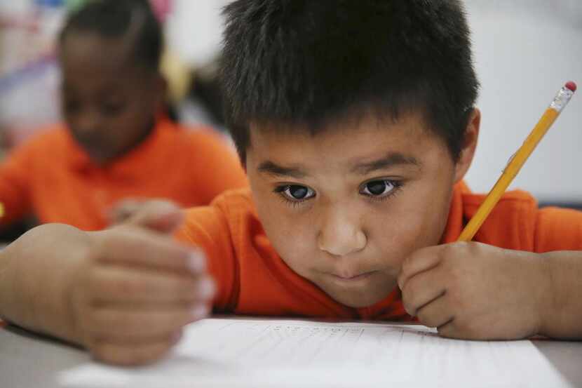 
First-grader Gerardo Quijas, 6, works on a math exercise in Brittany Hughes’ class. KIPP...