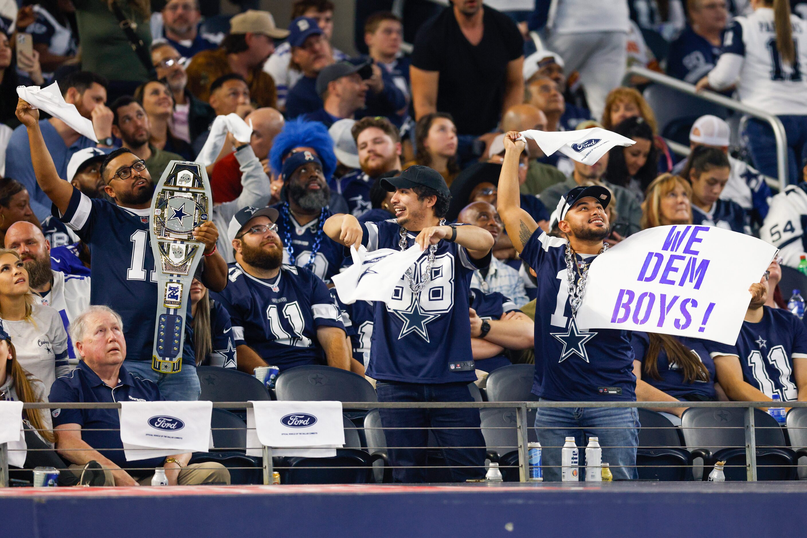 Dallas Cowboys fans cheer during the second half of an NFL game against the New York Giants,...