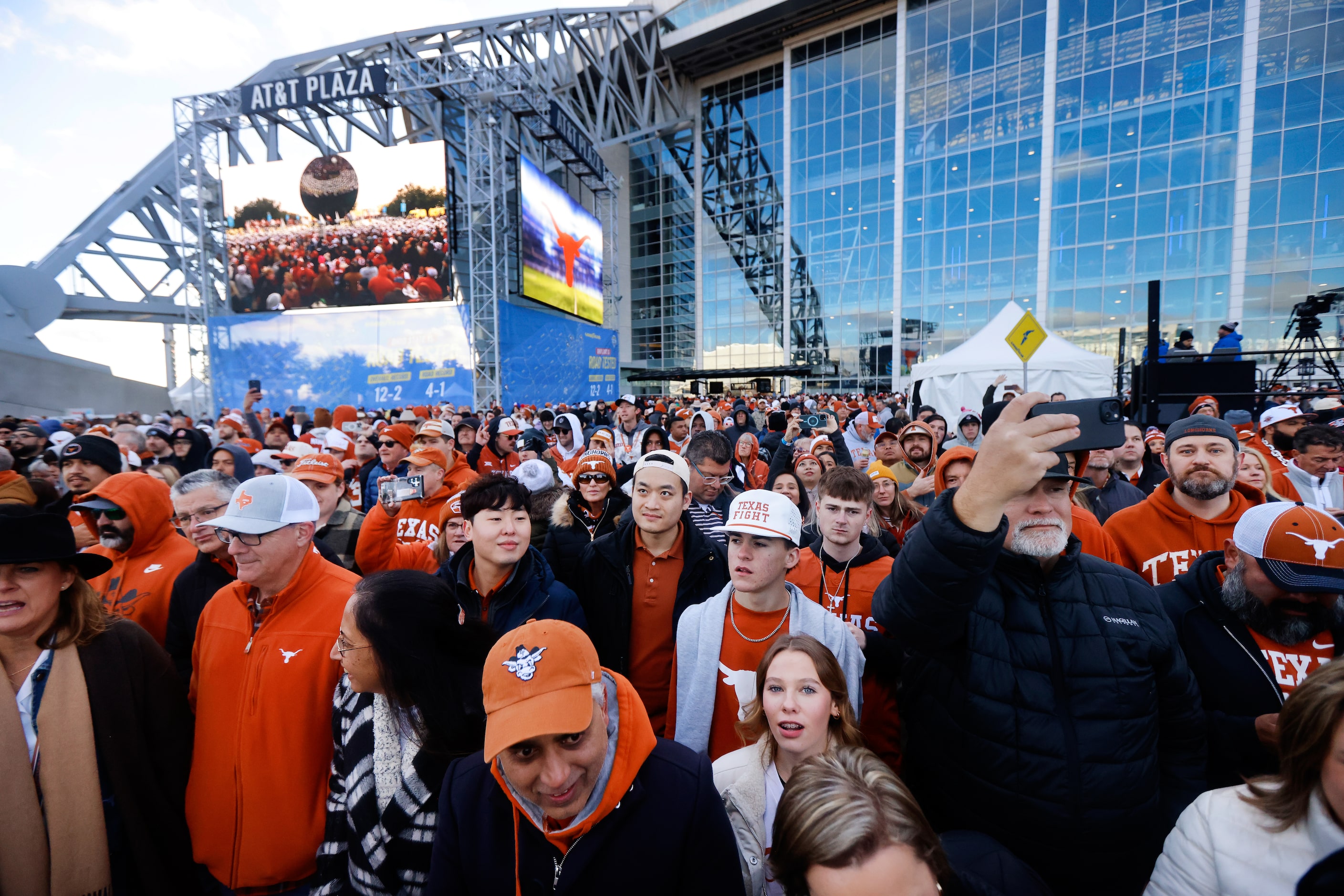 Texas Longhorns fans gather to hear the University of Texas Longhorn Band perform during a...