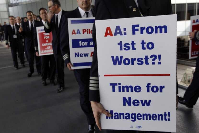 American Airlines pilots marched in September at O’Hare International Airport in Chicago to...