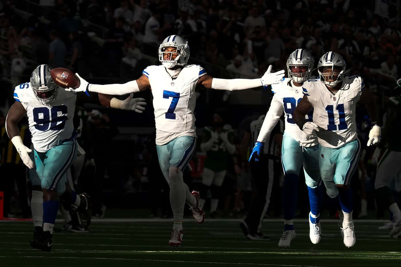 Dallas Cowboys cornerback Trevon Diggs (7) celebrates with defensive tackle Neville...