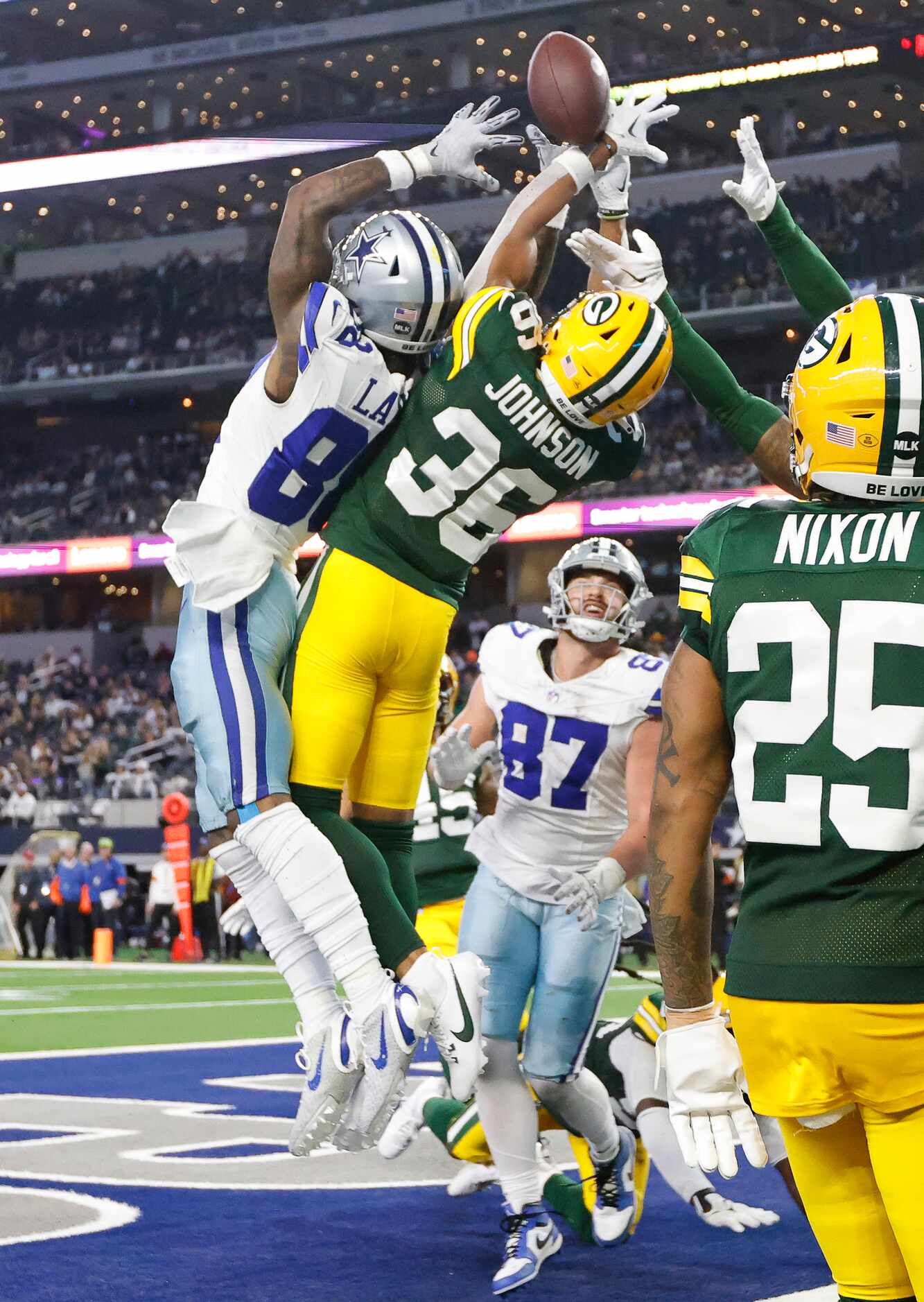 Dallas Cowboys wide receiver CeeDee Lamb (88) and Green Bay Packers safety Anthony Johnson...