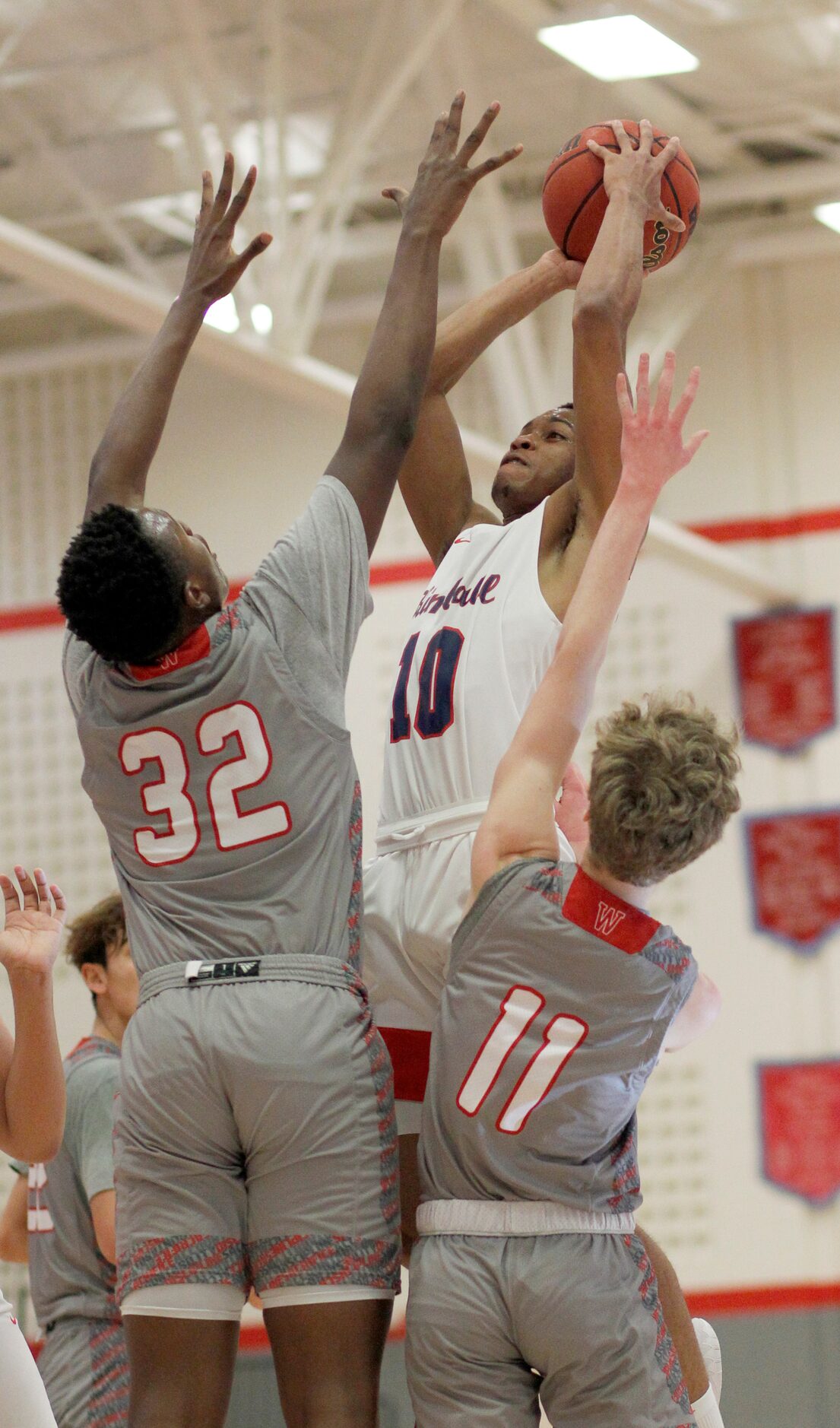 Dallas Kimball guard Deonte Greer (10) skies to sink a jump shot over the defense of Dallas...