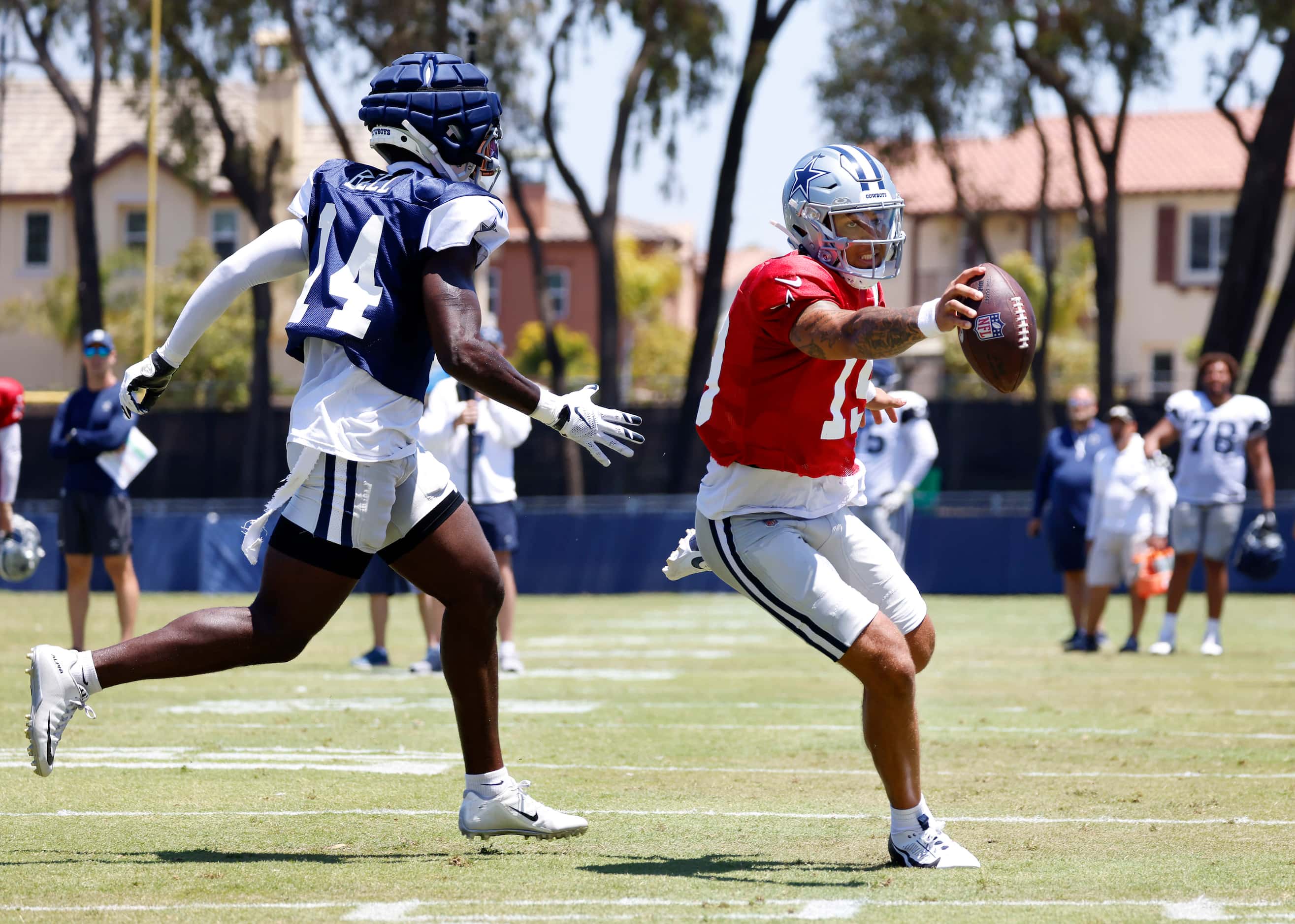 Dallas Cowboys quarterback Trey Lance (19) stretches the ball across the goal lone as he...