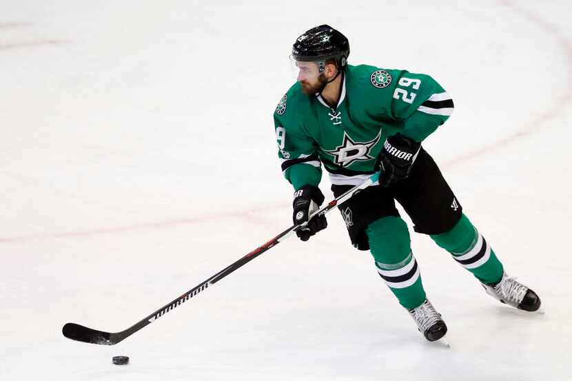 Dallas Stars' Greg Pateryn (29) controls the puck in the third period of an NHL hockey game...