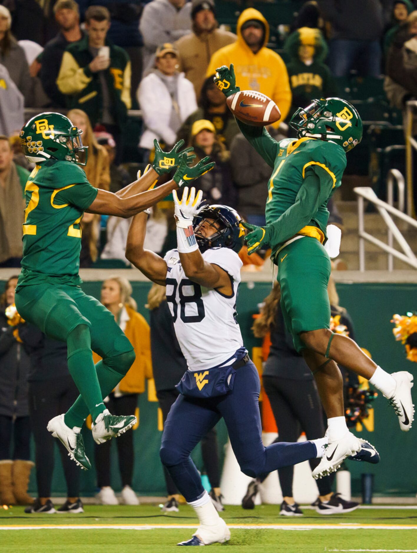 Baylor cornerback Grayland Arnold (1) breaks up a pass intended for West Virginia wide...