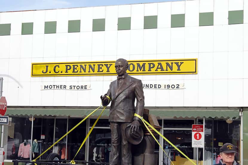 The James Cash Penney statue in front of the first J.C. Penney store, which still operates...